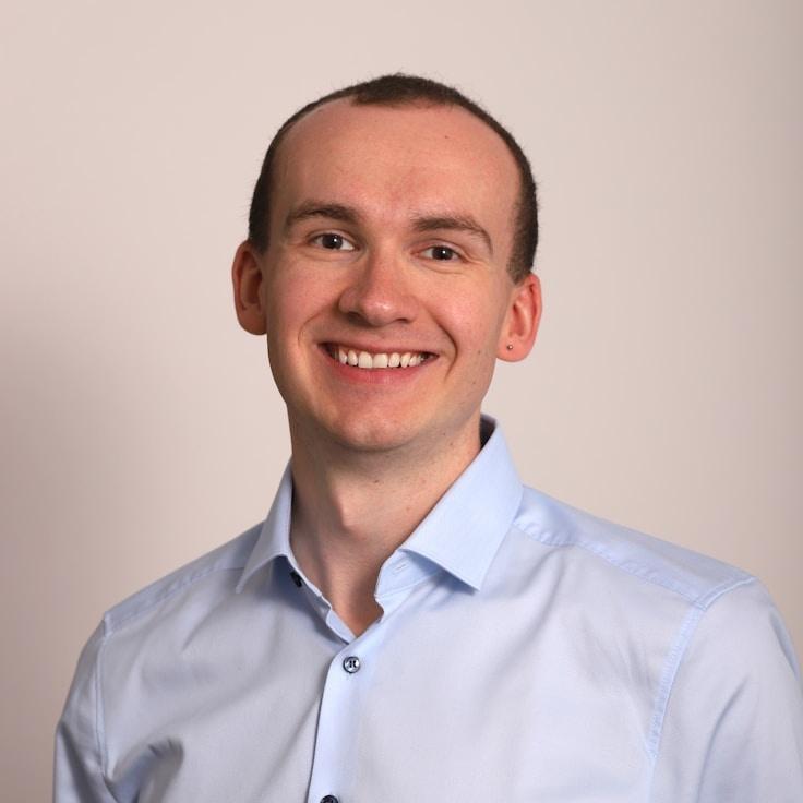 Kaveri Mehta, Lead Design Curator at SilverIsleBud, reviewing corporate floral arrangements